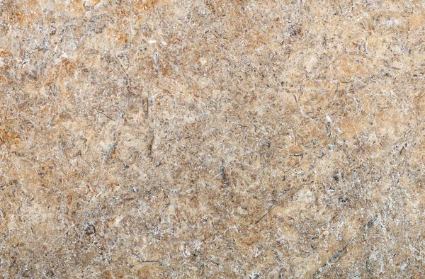 Yüksek çözünürlüklü taş granit levhanın bej ve kahverengi soyut deseni.