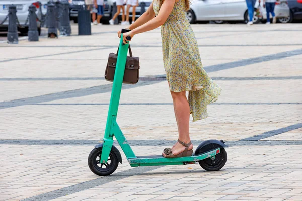 Young Woman Light Dress Rides Rental Electric Scooter City Copy — стоковое фото