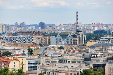 Aerial view, cityscape of Kyiv, view of old and new residential areas under construction on a summer day.