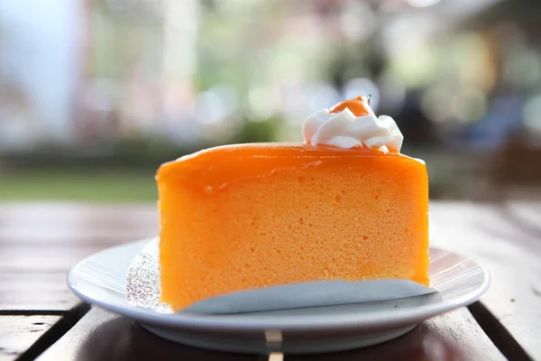 Orange cake on wood background — Stock Photo, Image