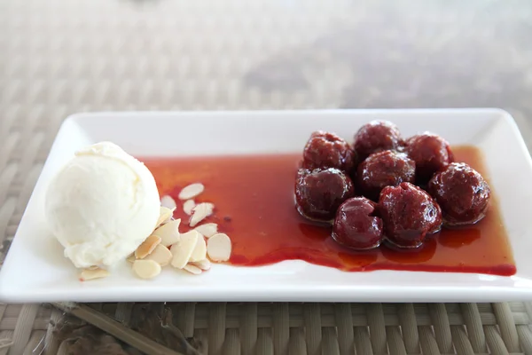 Cherry with ice cream — Stock Photo, Image