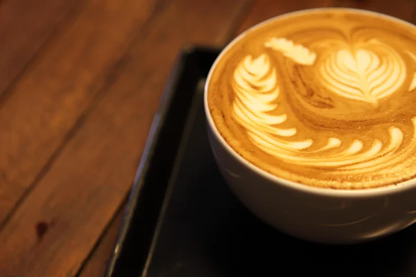Кофе на деревянном фоне — стоковое фото