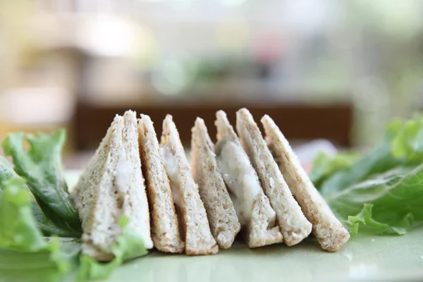 Tuna sandwich on wood background — Stock Photo, Image