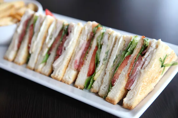 Club sandwich med på trä bakgrund — Stockfoto