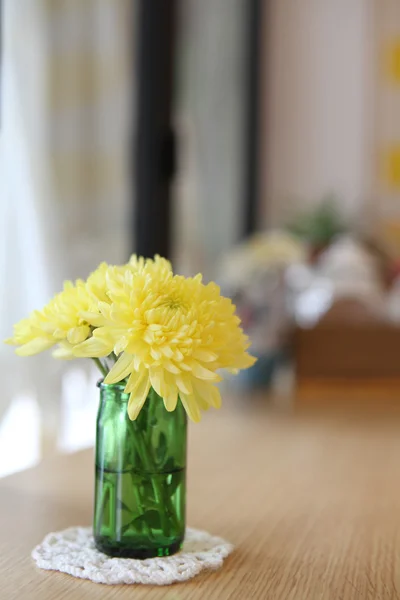 Yellow flower in jar — Stock Photo, Image