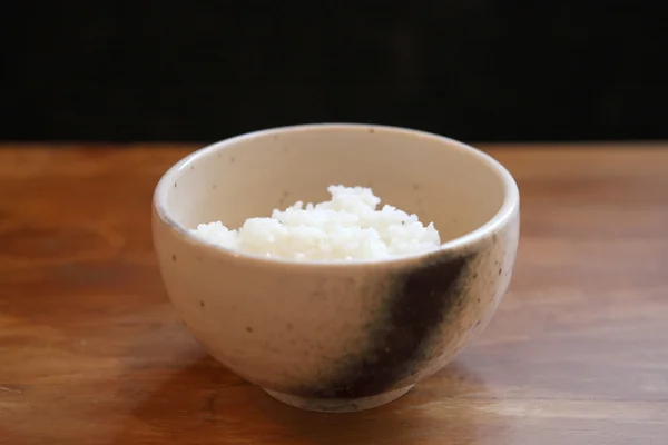 Rice with wood background — Stock Photo, Image