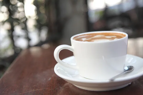 Kaffe på trä bakgrund — Stockfoto