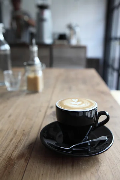 Café sobre fundo de madeira — Fotografia de Stock