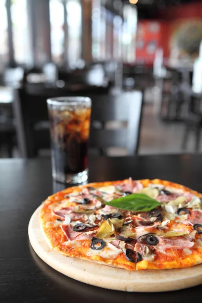 Pizza with dry cured ham and basil — Stock Photo, Image