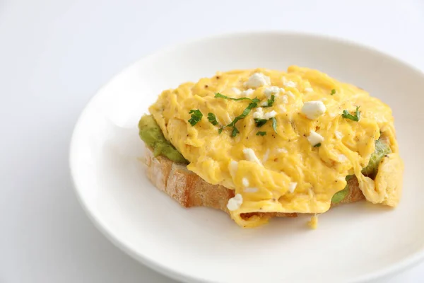 Avocado and scrambled eggs toast