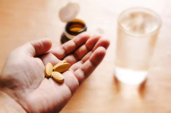 Pills in a hand — Stock Photo, Image