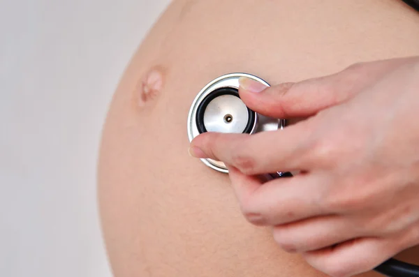 Pregnancy with stethoscope — Stock Photo, Image