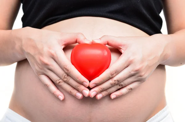 Gravida kvinnor med röda hjärtan — Stockfoto