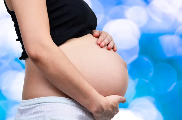 Kvinna med henne gravid — Stockfoto