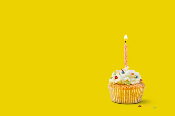 Yellow Background Festive Cupcake Burning Candle — Photo