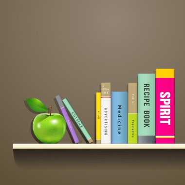 satır renkli kitap ve yeşil elma