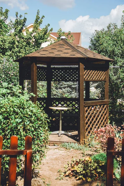 Beautiful gazebo in the garden. Place for company rest