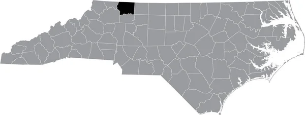 ノースカロライナ州の灰色の行政地図の中のサリー郡の黒いハイライト表示された場所 — ストックベクタ