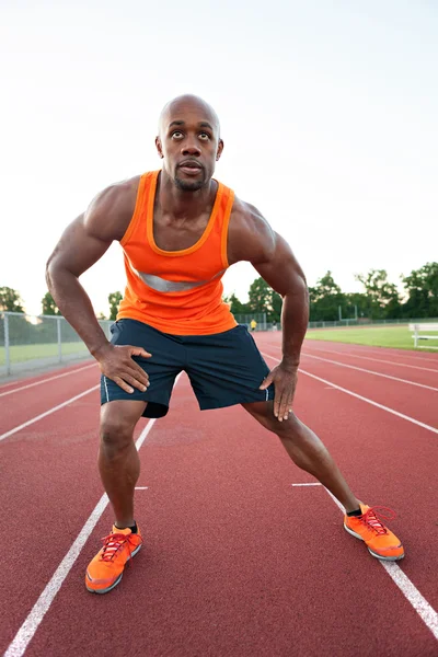 Runner Stretching zijn benen — Stockfoto