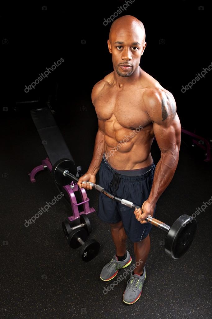 Muscle Man Bicep Curls Stock Photo by ArenaCreative 49959165