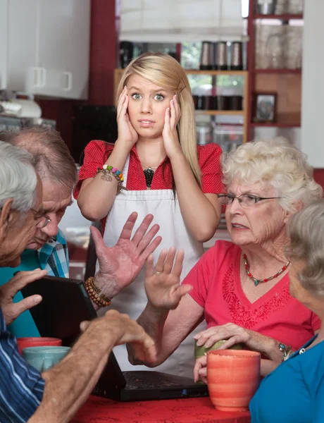 Bickering Seniors and Young Waitress — Stock Photo, Image