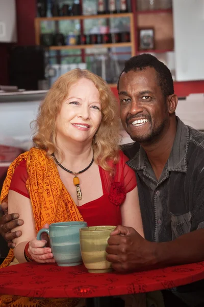 Happy Mixed Couple in Coffeehouse — Stock Photo, Image