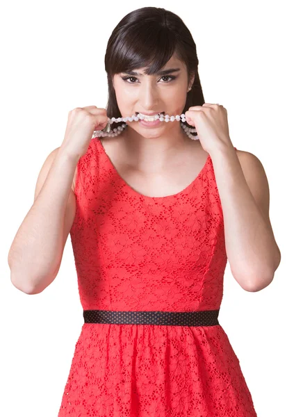 Senhora irritada mordendo colar — Fotografia de Stock