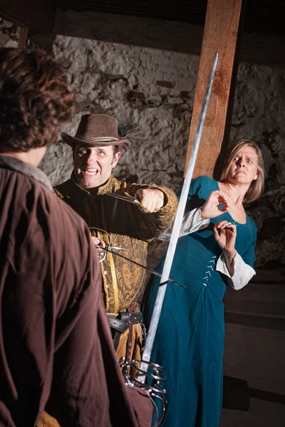 Scared Woman and Sword Fighter — Stock Photo, Image