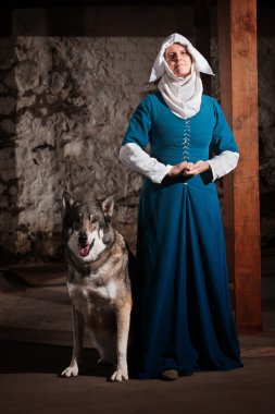 Nun with Dog Indoors clipart
