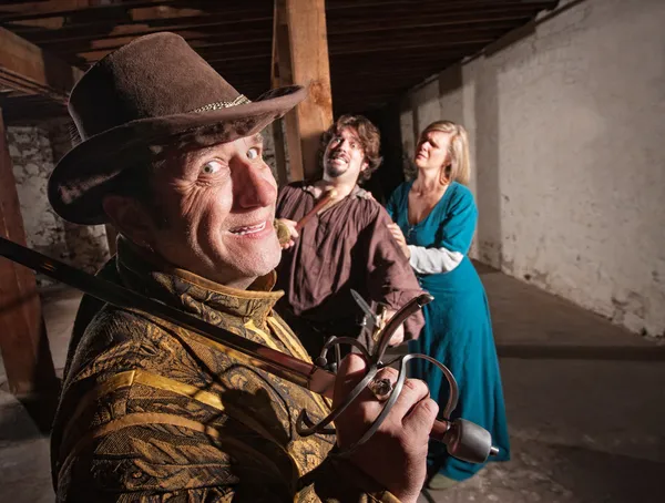 Victorious Swordsman with Mace on Victim — Stock Photo, Image