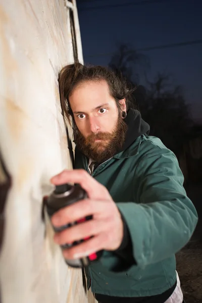 Man with Beard Spray Painting — Stock Photo, Image