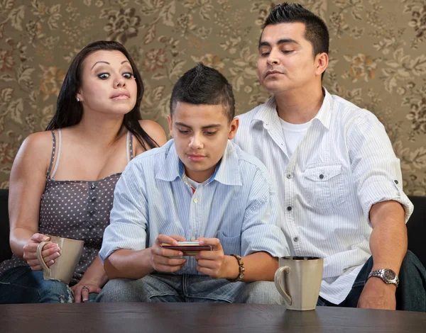 Parents Watching Teen Sending Messages — Stock Photo, Image