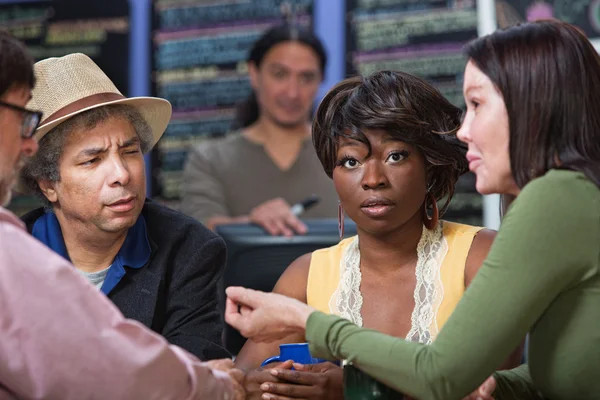 Perplexed Woman with Group in Cafe — Stock Photo, Image