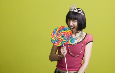 Young punk woman with a big lollipop clipart