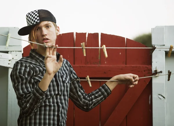 Teenage Boy Leaning on a Clothesline — Stock Photo, Image