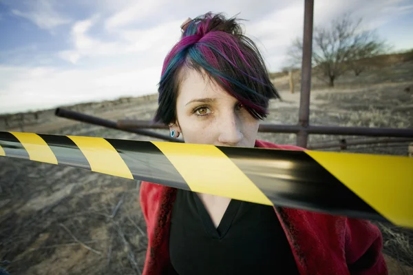 Punk Girl Behind Caution tape — Stock Photo, Image