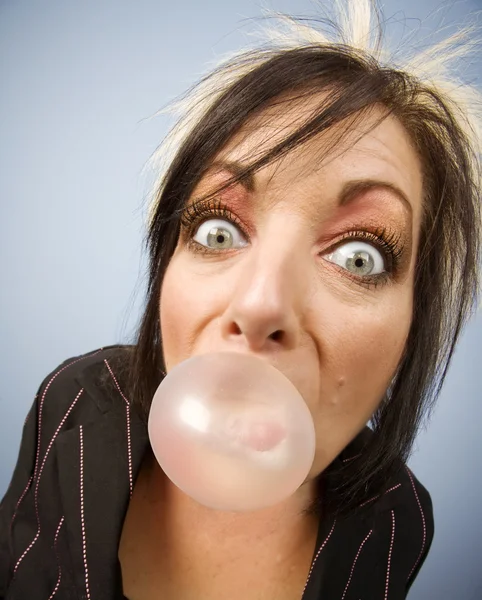 Woman blowing a bubble — Stock Photo, Image