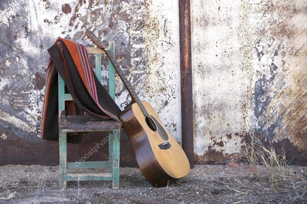 Acoustic Guitar Leaning on a Chair