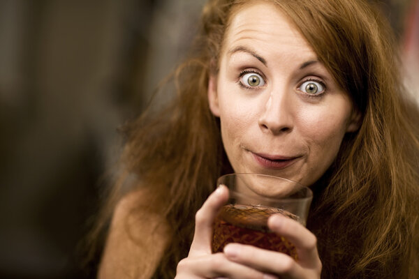 Woman sipping a cocktail