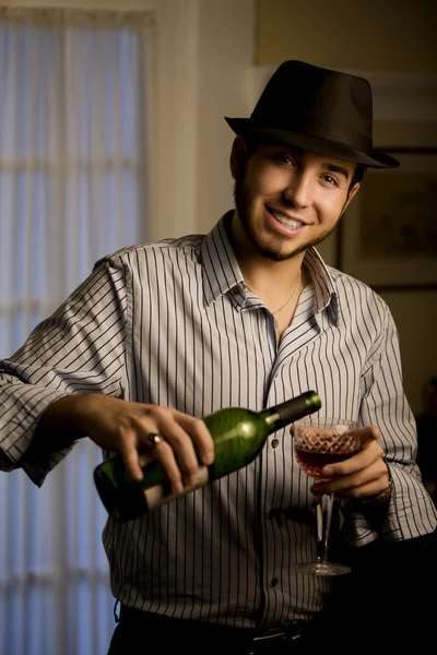 Young Man in a Fedora with Red Wine — Stock Photo, Image