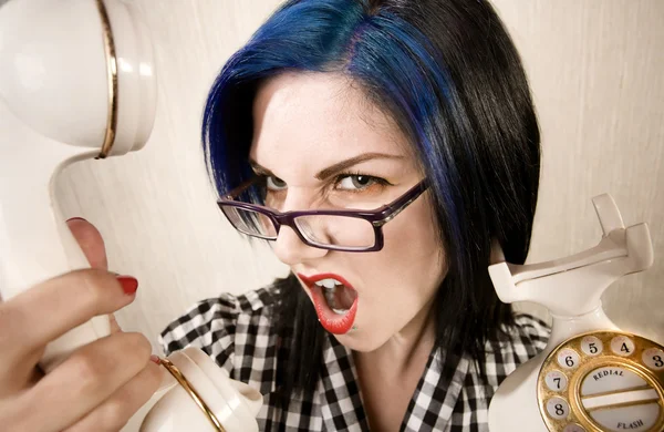 Pretty young woman yelling into a phone — Stock Photo, Image