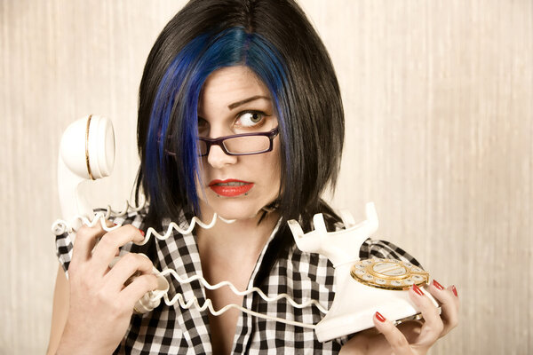 Pretty young woman wrapped in a phone cord