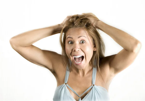 Mujer étnica tirando de su cabello —  Fotos de Stock