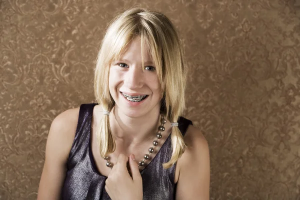 Young blonde girl with braces — Stock Photo, Image