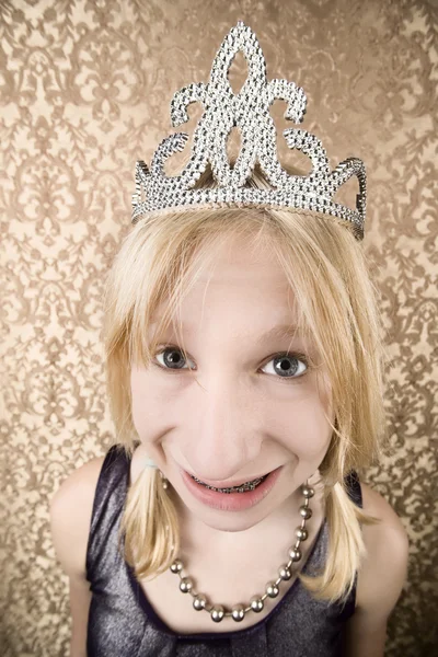 Pretty young girl with a tiara with braces — Stock Photo, Image