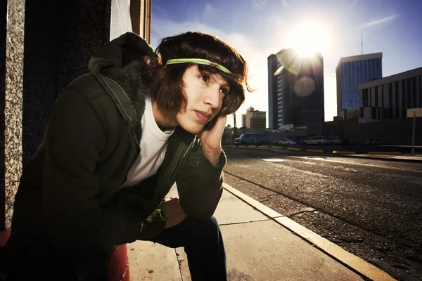 Handsome young man at sundown in city — Stock Photo, Image