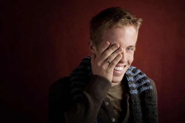 Young man covering his face — Stock Photo, Image