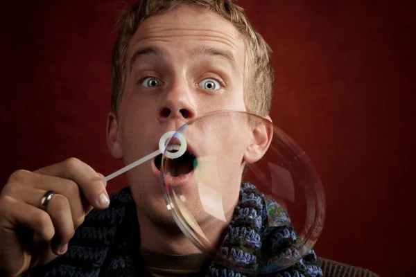 Young Man Blowing a Bubble — Stock Photo, Image