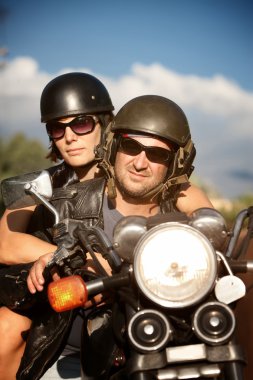 Man and Woman on Motorcycle clipart