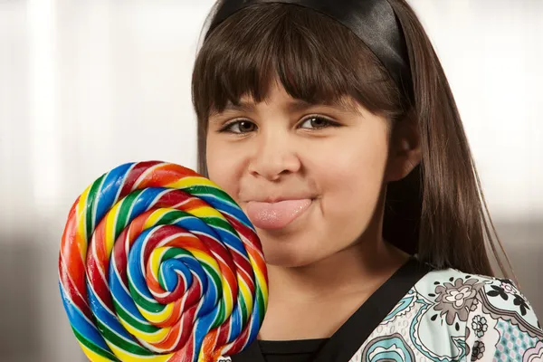Cute young girl with lollipop — Stock Photo, Image